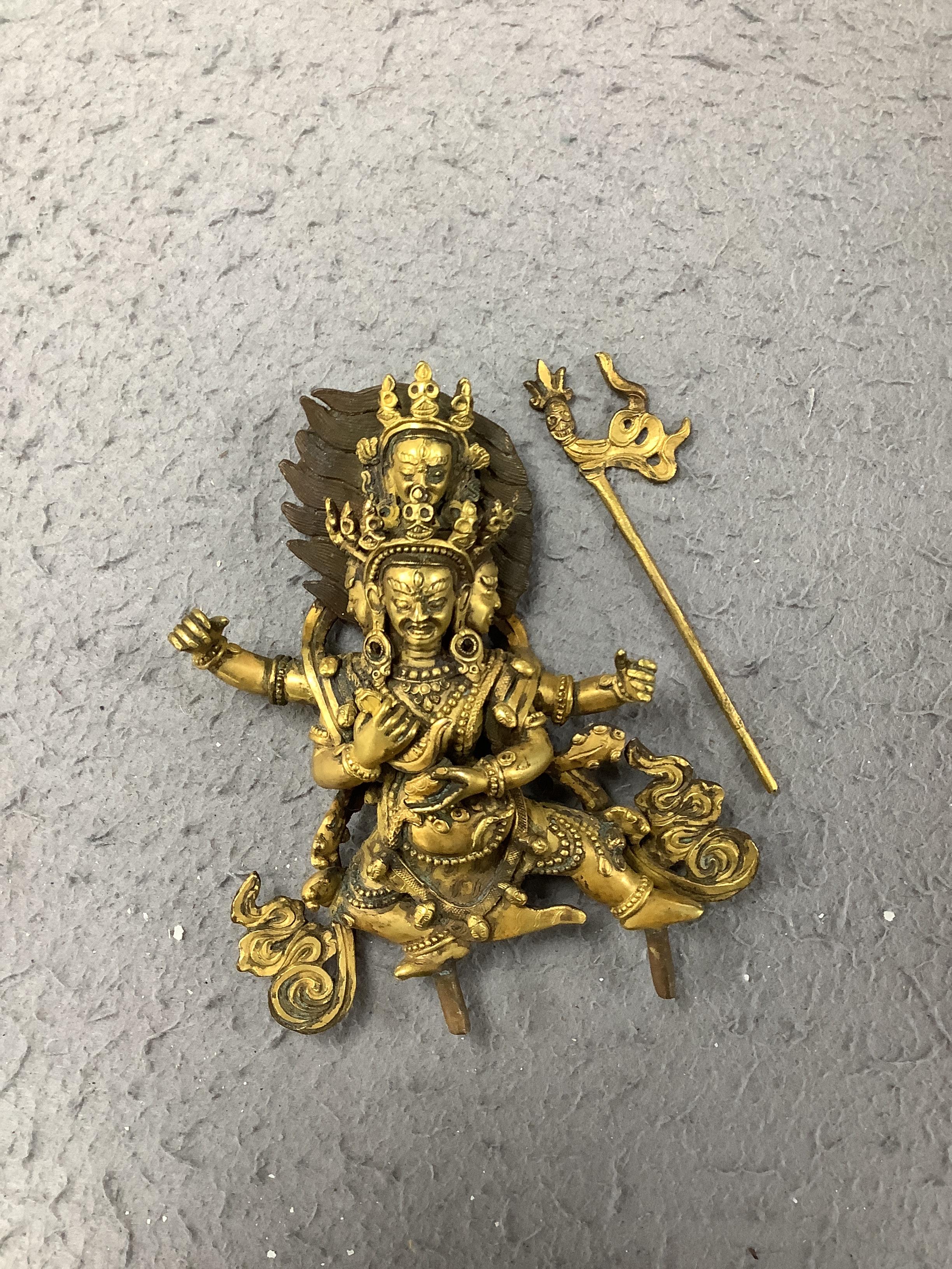 A Sino Tibetan gilt bronze figure of Mahakala, 23cm high